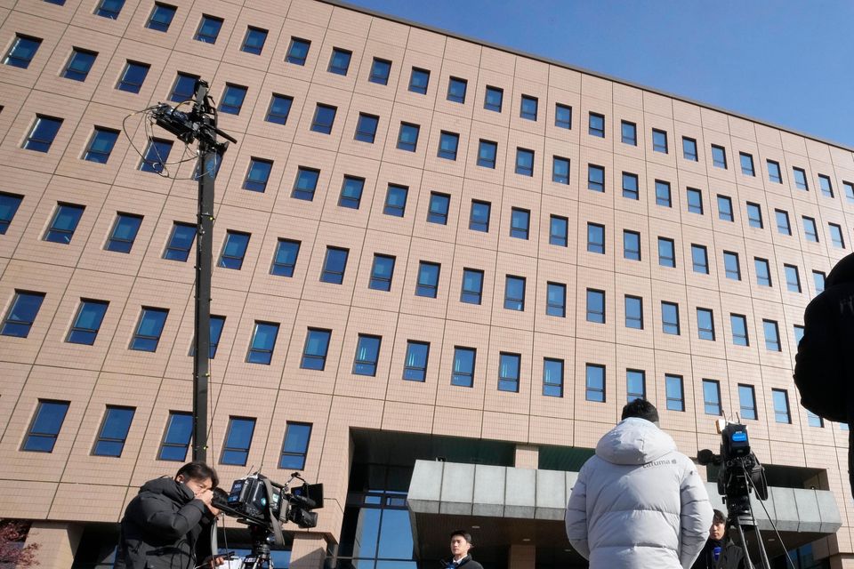 Media members wait for the arrival of impeached South Korean President Yoon Suk Yeol near the Corruption Investigation Office for High-ranking Officials in Gwacheon (Ahn Young-joon/AP)