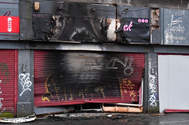 Van rammed into Belfast shop and set alight in arson attack