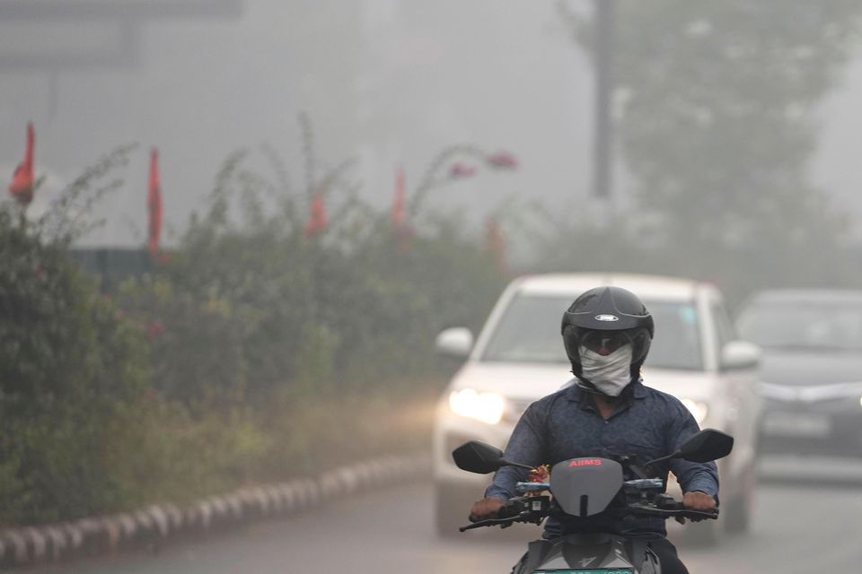 Commuters drive through the smog (Manish Swarup/AP)