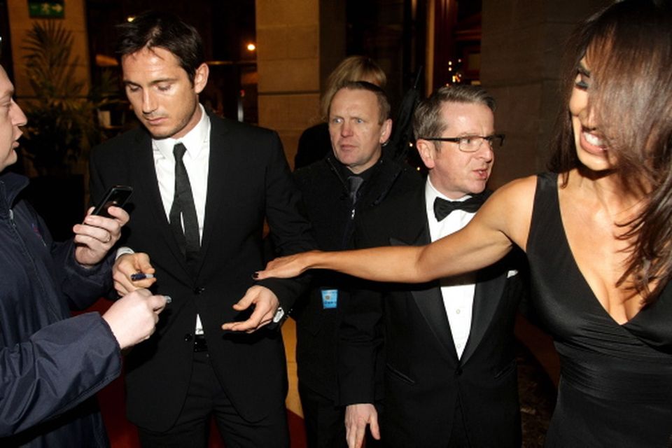26.11.10. Picture by David Fitzgerald. The 2010 GO Belfast awards which took place last night in the Europa Hotel. Christine Bleakley pulling Frank Lampard as he tries to sign autographs for fans