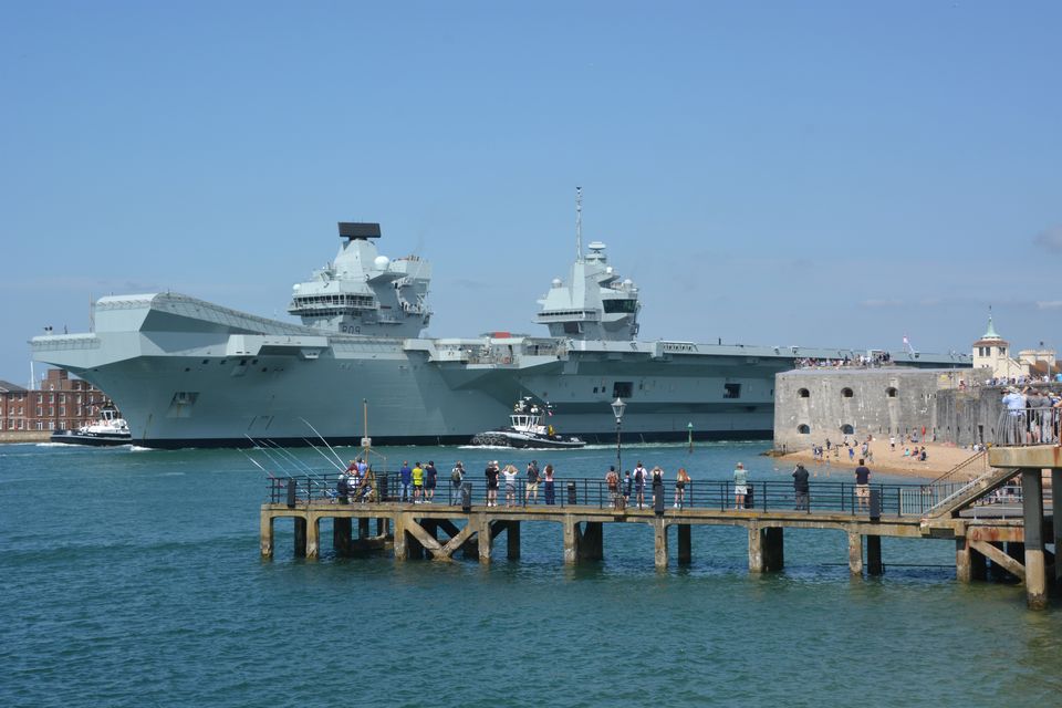 The Royal Navy aircraft carrier HMS Prince of Wales sets sail from Portsmouth Harbour (Ben Mitchell/PA)