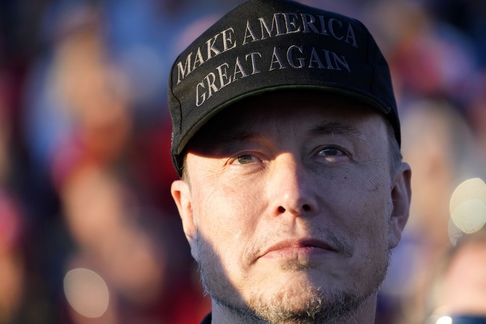 Mr Musk listens as Mr Trump speaks (Alex Brandon/AP)