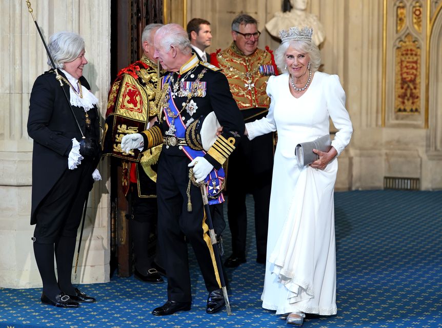 The King chats happily to Black Rod as he leaves the State Opening (Chris Jackson/PA)