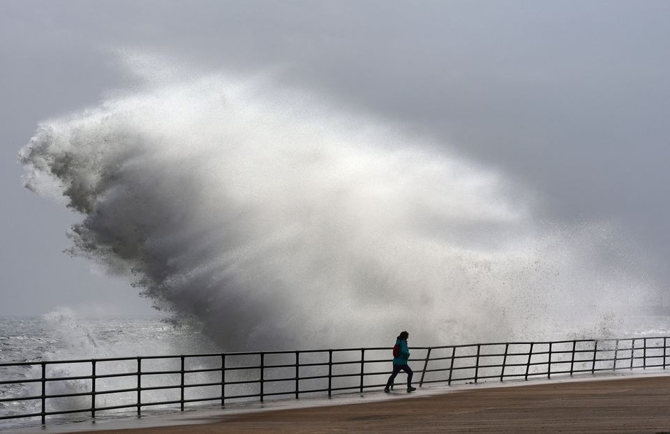 Huge waves smash against the seafront at Whitley Bay in North Tyneside (Owen Humphreys/PA)