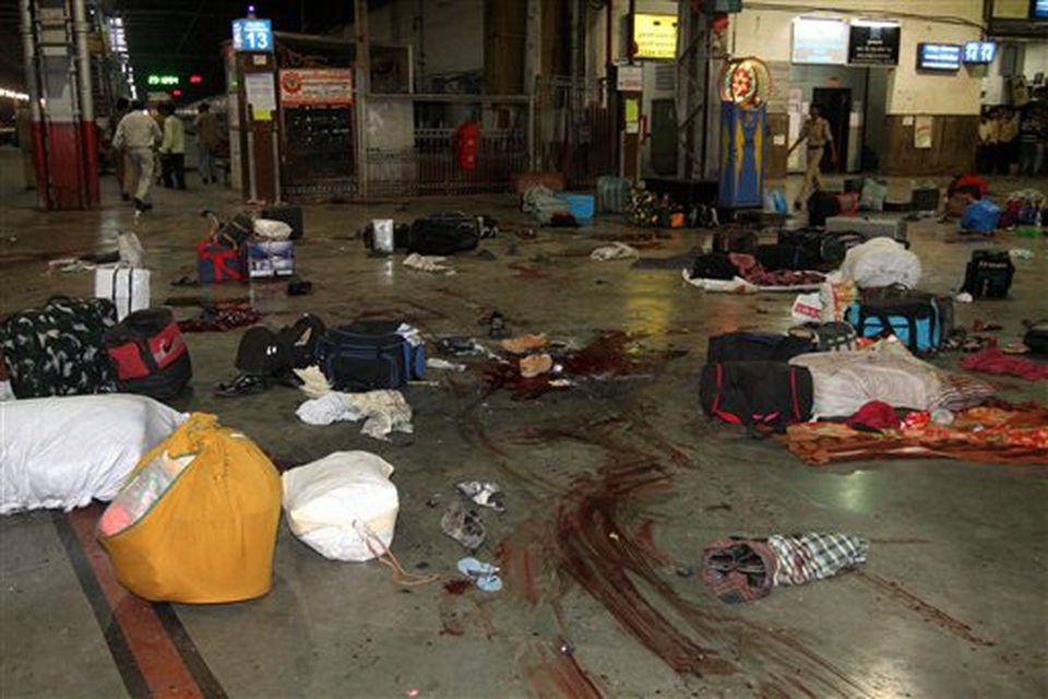 ** EDS NOTE GRAPHIC CONTENT ** Luggage of passengers lie scattered on a blood splattered platform at the Chhatrapati Shivaji Terminus railway station in Mumbai, India, Wednesday, Nov. 26, 2008. Police say several people have been wounded in a series of attacks by terrorist gunmen at seven sites in Mumbai, including two luxury hotels. A.N. Roy, a senior police officer, says police were battling the gunmen. (AP Photo)