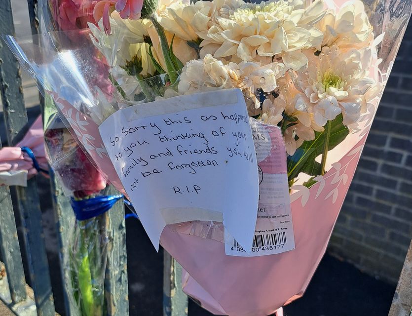 Floral tributes left at the scene in Heights Drive, Wortley, following the death of parcel delivery driver Claudiu-Carol Kondor (Matt Gibson/PA)