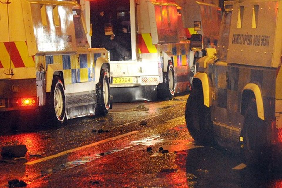 Police on patrol during disturbances which erupted in east Belfast