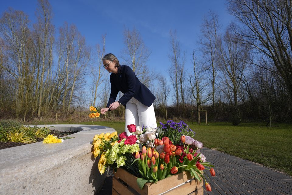 National Memorial Arboretum Managing Director Philippa Rawlinson laying flowers at the Trees of Life glade at the National Memorial Arboretum, in Burton-on-Trent (Danny Lawson/PA)