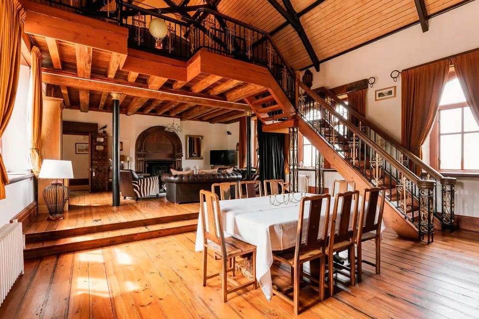 Dining area and the oak staircase leading to a mezzanine