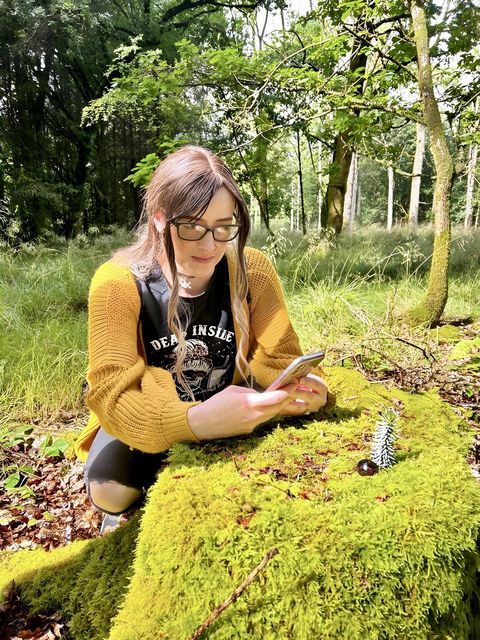 Tracy Wallace taking photos of her creations in Randalstown forest
