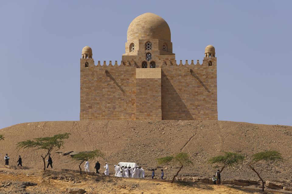 People carry the coffin of Prince Karim Al-Hussaini, the Aga Khan IV and 49th hereditary imam of the Shiite Ismaili Muslims, to be buried at the Aga Khan mausoleum in Aswan (Haytham Fahmy/AP)