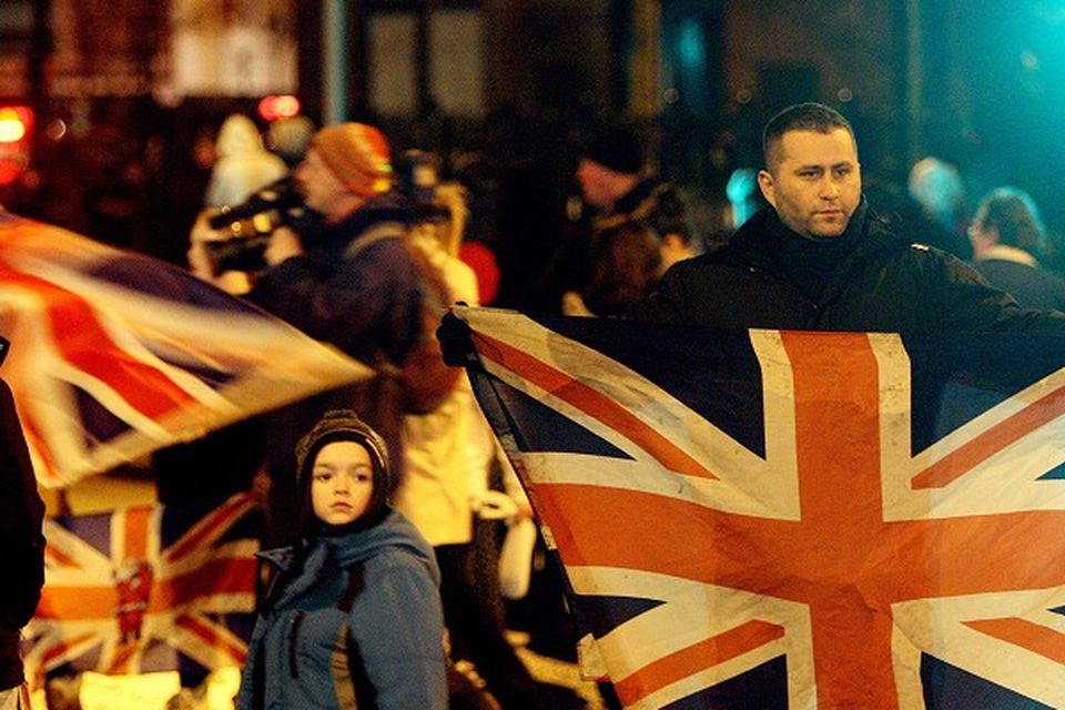 Loyalists block the Sandy Row area of Belfast as part of a mass protest over flags