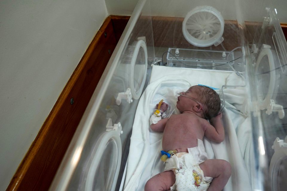 A Palestinian baby boy, not yet named, delivered prematurely after his mother Ola al-Kurd was killed in an Israeli strike,(Abdel Kareem Hana/AP)