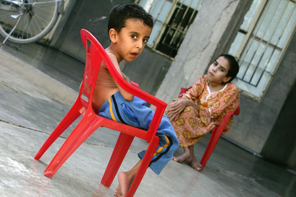 ousif Hamed (L), age 4 years old, and his sister Inas who suffer from birth defects are seen on November 12, 2009 at their house in the city of Falluja west of Baghdad, Iraq