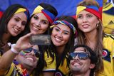 thumbnail: he beautiful game - football fans from around the world -  Colombia fans pose for a photo during the 2014 FIFA World Cup Brazil Group C match between Japan and Colombia at Arena Pantanal on June 24, 2014 in Cuiaba, Brazil.  (Photo by Adam Pretty/Getty Images)