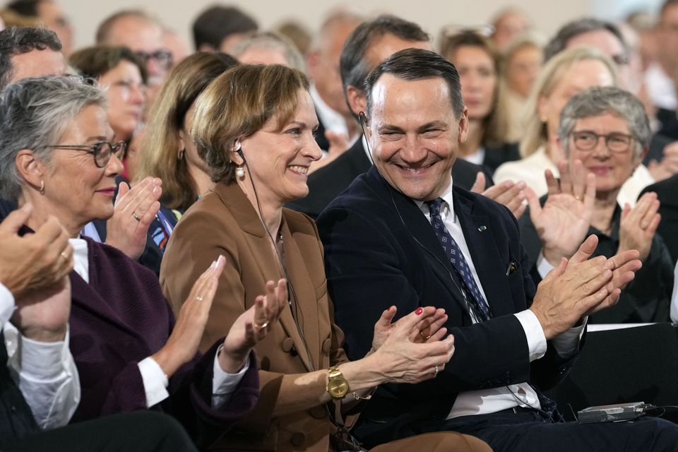 Anne Applebaum with her husband, Poland’s foreign minister Radoslaw Sikorski (Martin Meissner, Pool, AP)