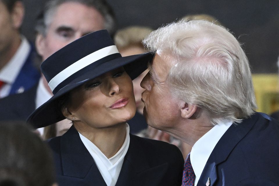 Donald Trump kisses Melania before the 60th Presidential Inauguration (Saul Loeb/Pool photo via AP)