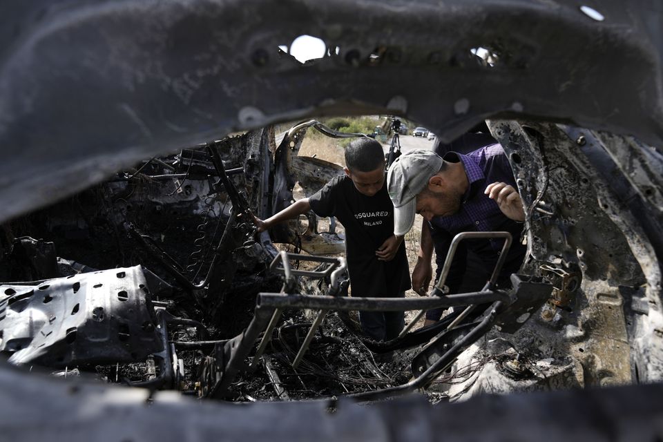 The car was destroyed in a drone strike (Majdi Mohammed/AP)