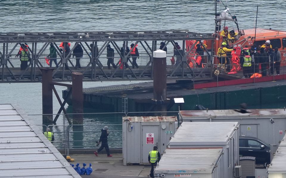 A group of people thought to be migrants are brought in to Dover (Gareth Fuller/PA)