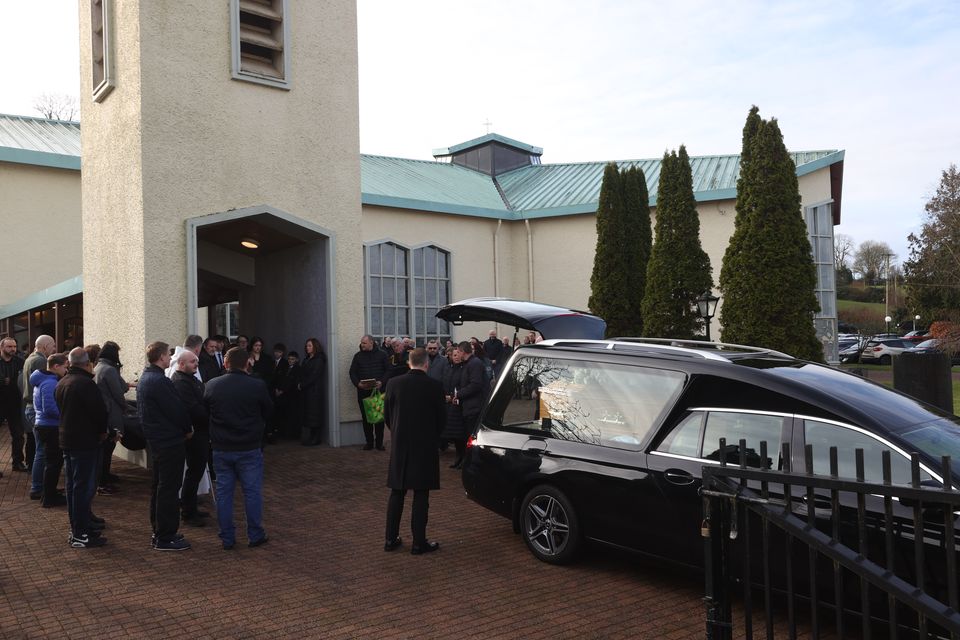 The coffin of Kacper Dudek is taken from St Patrick’s Church in Murlog (Liam McBurney/PA)