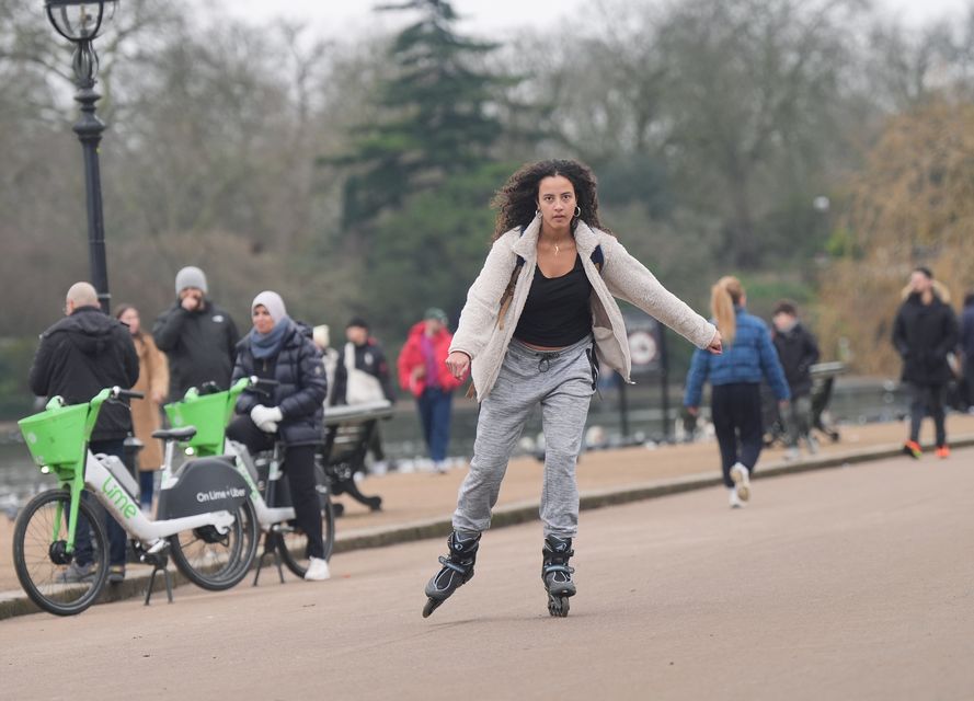 A woman rollerblades through central London (Yui Mok/PA)