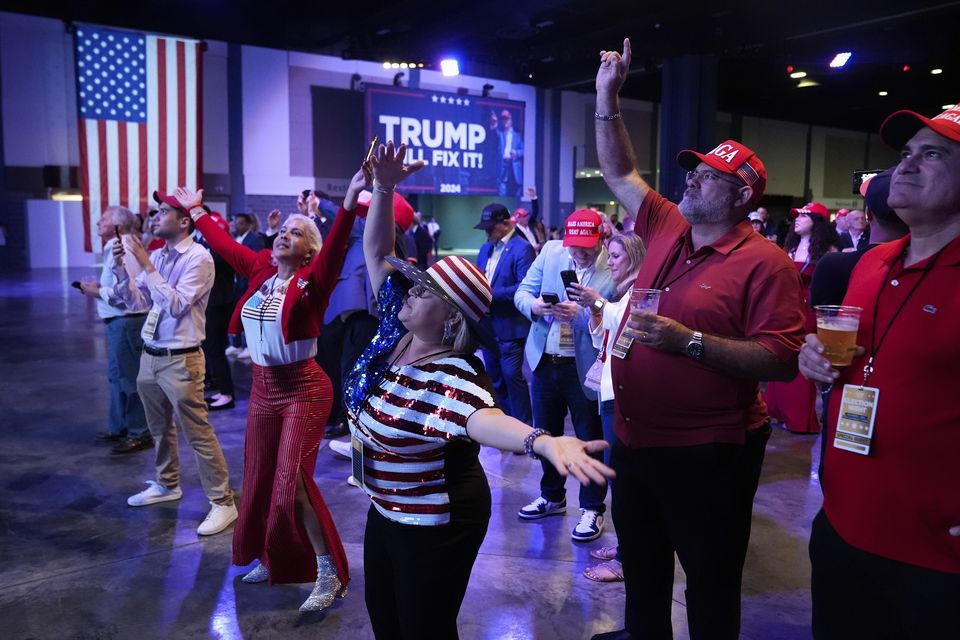 Supporters dance at an election night campaign watch party for Donald Trump in West Palm Beach, Florida (Alex Brandon/AP)