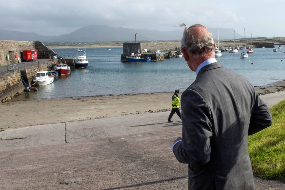 Britain's Prince Charles, Prince of Wales visits the harbour in the village of Mullaghmore in Ireland on May 20, 2015 where the prince's great-uncle Lord Mountbatten was killed in an IRA explosion in 1979. Britain's Prince Charles spoke of his "anguish" at the murder of his godfather by IRA paramilitaries in 1979 as he became the first royal to visit the assassination site in Ireland.  Charles remembered Lord Louis Mountbatten as "the grandfather I never had" on an emotional trip to the rugged coastline, saying he understood the suffering of the Irish people in "a profound way".  Peter McHugh helped with the rescue effort in the aftermath of the 1979 attack.  AFP PHOTO / POOL / ARTHUR EDWARDSARTHUR EDWARDS/AFP/Getty Images