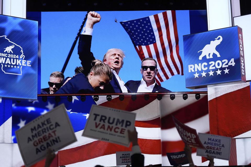 Pictures of the assassination attempt of Donald Trump displayed during the Republican National Convention on July 18 in Milwaukee (Jae C Hong/AP)