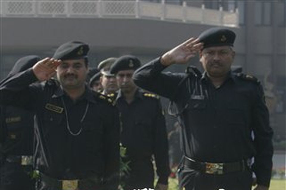National Security Guard commandoes pay tribute to commando Gajendra Singh, in New Delhi, India, Saturday, Nov. 29,  2008. Indian commandos killed the last remaining gunmen holed up at a luxury Mumbai hotel Saturday, ending a 60-hour rampage through India's financial capital by suspected Islamic militants that killed people and rocked the nation. (AP Photo/Mustafa Quraishi)