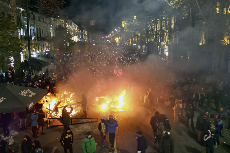 Protesters pour into the streets following Georgian Prime Minister Irakli Kobakhidze’s announcement (Zurab Tsertsvadze/AP)