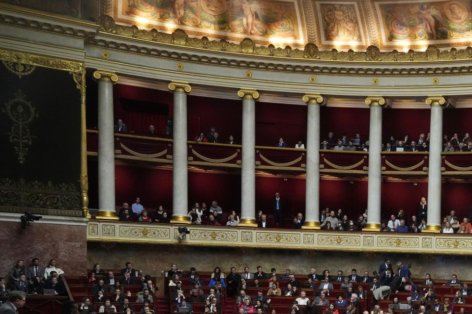 Lawmakers convene at the National Assembly in Paris during a debate and prior to a no-confidence vote (AP Photo/Michel Euler)