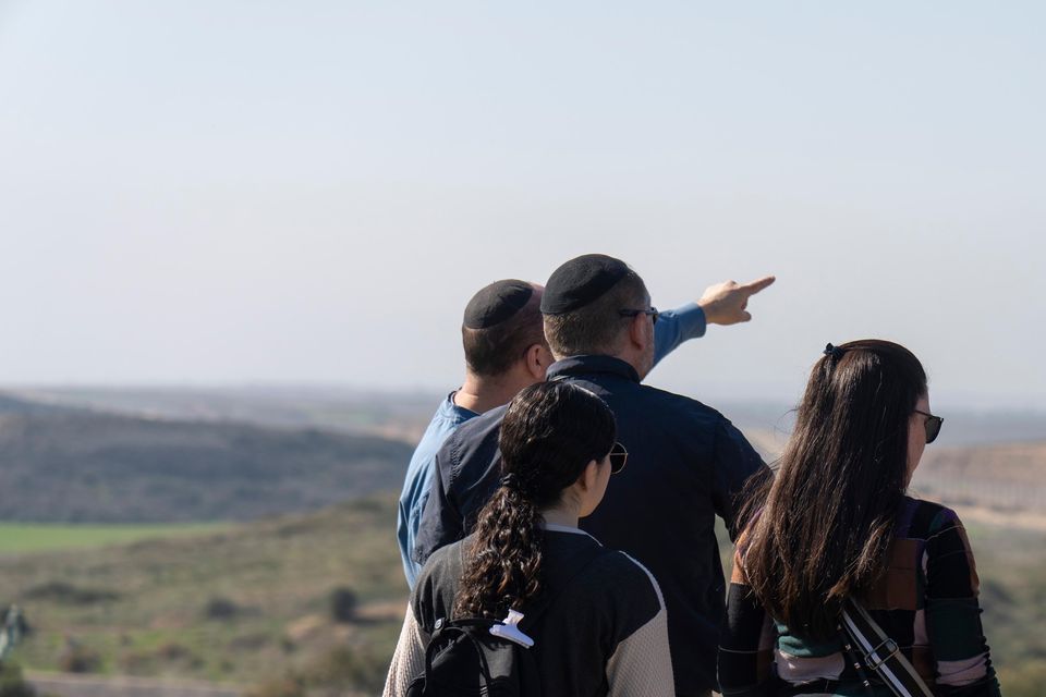 People look at the Gaza Strip from an observation point in Sderot, southern Israel (Ariel Schalit/AP)