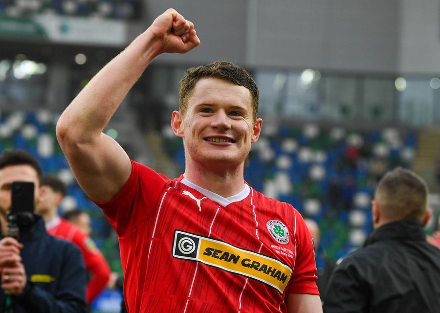 Cliftonville defender Paddy Burns celebrates the Reds' Irish Cup success after defeating Linfield