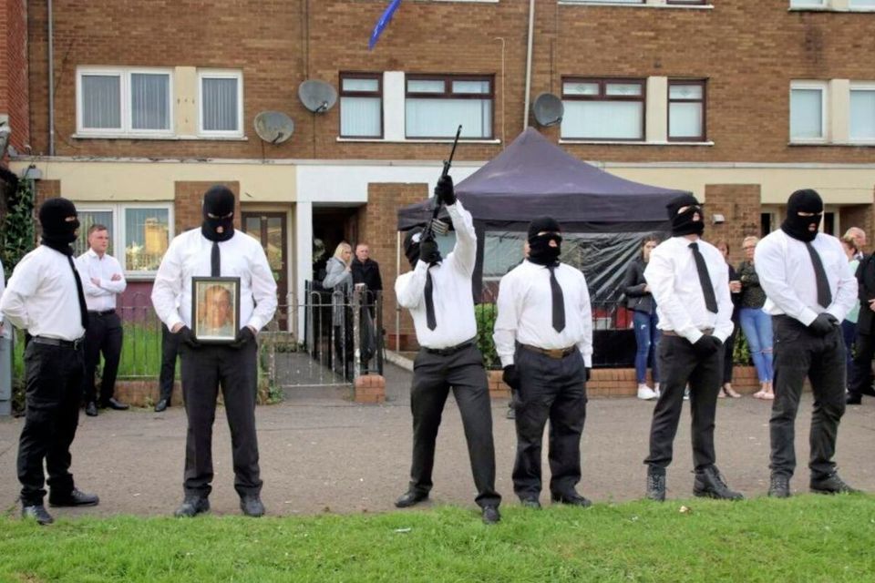An INLA man firing shots at a funeral in west Belfast