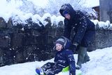 thumbnail: Pacemaker Press Belfast 08-12-2017: 
Heavy snow showers overnight have led to disruption across parts of Northern Ireland. Dozens of schools have been closed due to the wintery conditions. The snowfall means an unexpected day off for some young people. Police are advising road users to use extreme caution on the roads. Paul and Ollie Forbes pictured enjoying the snow.
Picture By: Arthur Allison/Pacemaker.