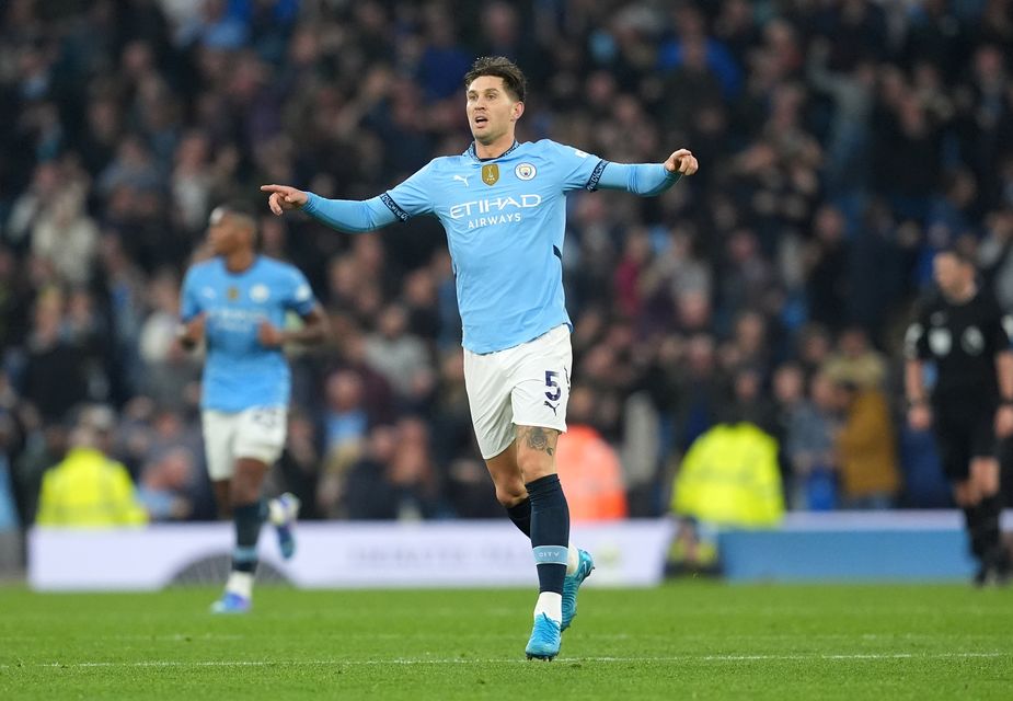 John Stones celebrates scoring City’s equaliser in the seventh minute of stoppage time (Martin Rickett/PA)