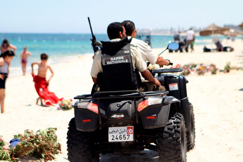 Tunisian security forces patrol a beach in Sousse, south of the capital Tunis, on July 1, 2015, as Tunisia started deploying armed police around tourist sites following last week's massacre in Port El Kantaoui by a jihadists gunman. Tunisian authorities vowed new heightened security measures, including 1,000 armed officers to reinforce tourism police -- who will be armed for the first time -- at hotels, beaches and other attractions. AFP PHOTO / BECHIR TAIEBBECHIR TAIEB/AFP/Getty Images