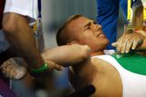 thumbnail: Janos Baranyai of Hungary is tended to after injuring his arm during the Men's 77kg weightlifting competition at the University of Aeronautics and Astronautics Gymnasium