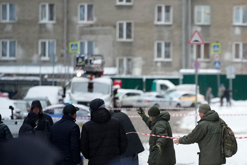 Investigators work at the scene in Moscow (AP)