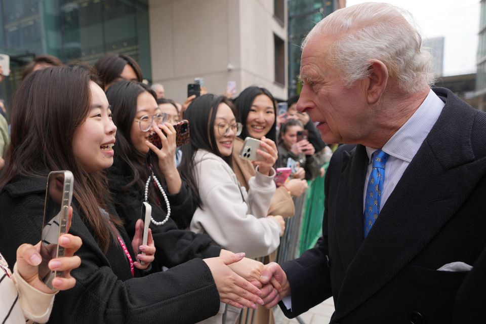 The King meets students and members of the public (Kirsty Wigglesworth/PA)