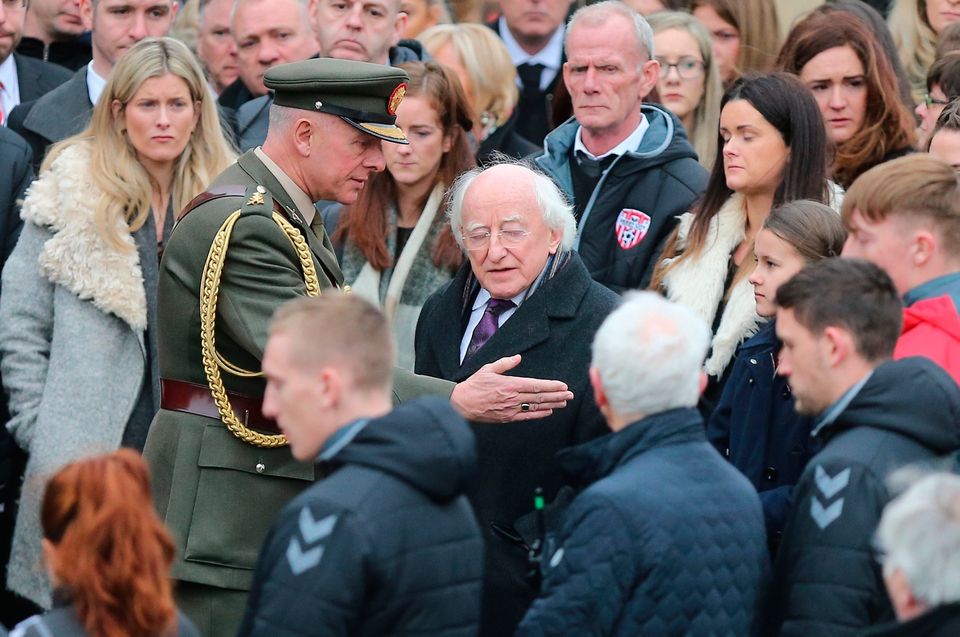 Michael D. Higgins, President of Ireland (centre) at the funeral of Derry City football captain Ryan McBride at the Long Tower church in Londonderry, who was found dead at home on Sunday night aged 27. Niall Carson/PA Wire