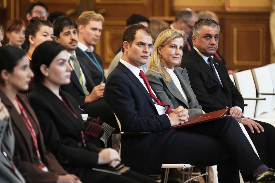 Foreign Office minister Hamish Falconer and the Duchess of Edinburgh listen during the engagement (Aaron Chown/PA)