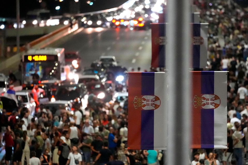 People block a highway in Belgrade during a protest against pollution and the exploitation of a lithium mine in Serbia (Darko Vojinovic/AP)