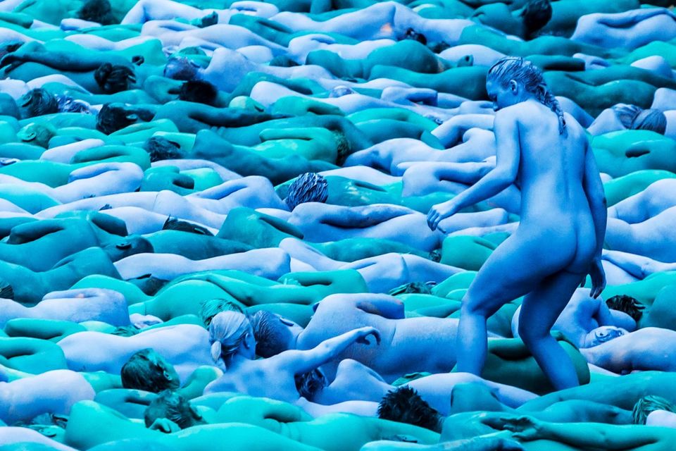 People take part in an installation titled Sea of Hull by artist Spencer Tunick in Hull. PA