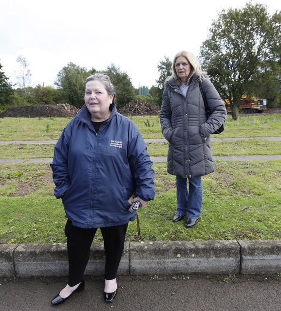 Toni Maguire, and Siubhainin Ni Chutnneagan (right) pictured in Milltown Cemetery in Belfast