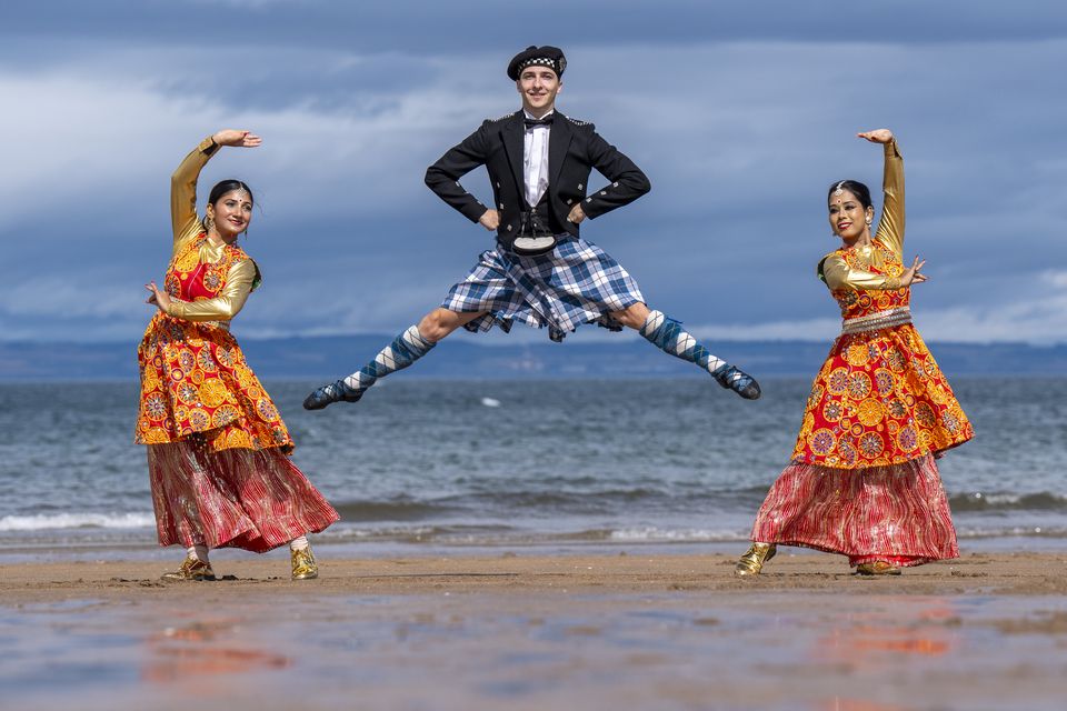 Members of the Edinburgh Tattoo Highland Dancers joined Teamwork Arts India to practise some dance moves on the beach at Gullane, East Lothian, ahead of their performance at the Royal Edinburgh Military Tattoo at Edinburgh Castle in August (Jane Barlow/PA)