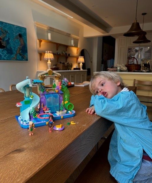 Louise Thompson’s son Leo with the Heartlake City Water Park toy from the Lego Group (Louise Thompson/PA)