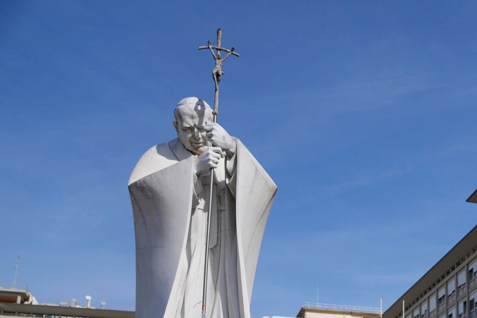 People pray outside the Agostino Gemelli Polyclinic in Rome (Gregorio Borgia/AP)