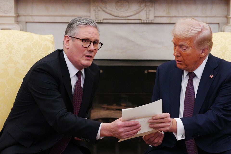 Donald Trump is presented with a letter from the King (Carl Court/PA)