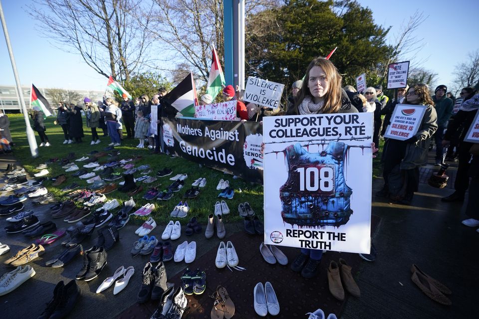 108 pairs of shoes for each journalist killed in Gaza are laid out as Mother’s Against Genocide protest outside RTE in Dublin (Niall Carson/PA)